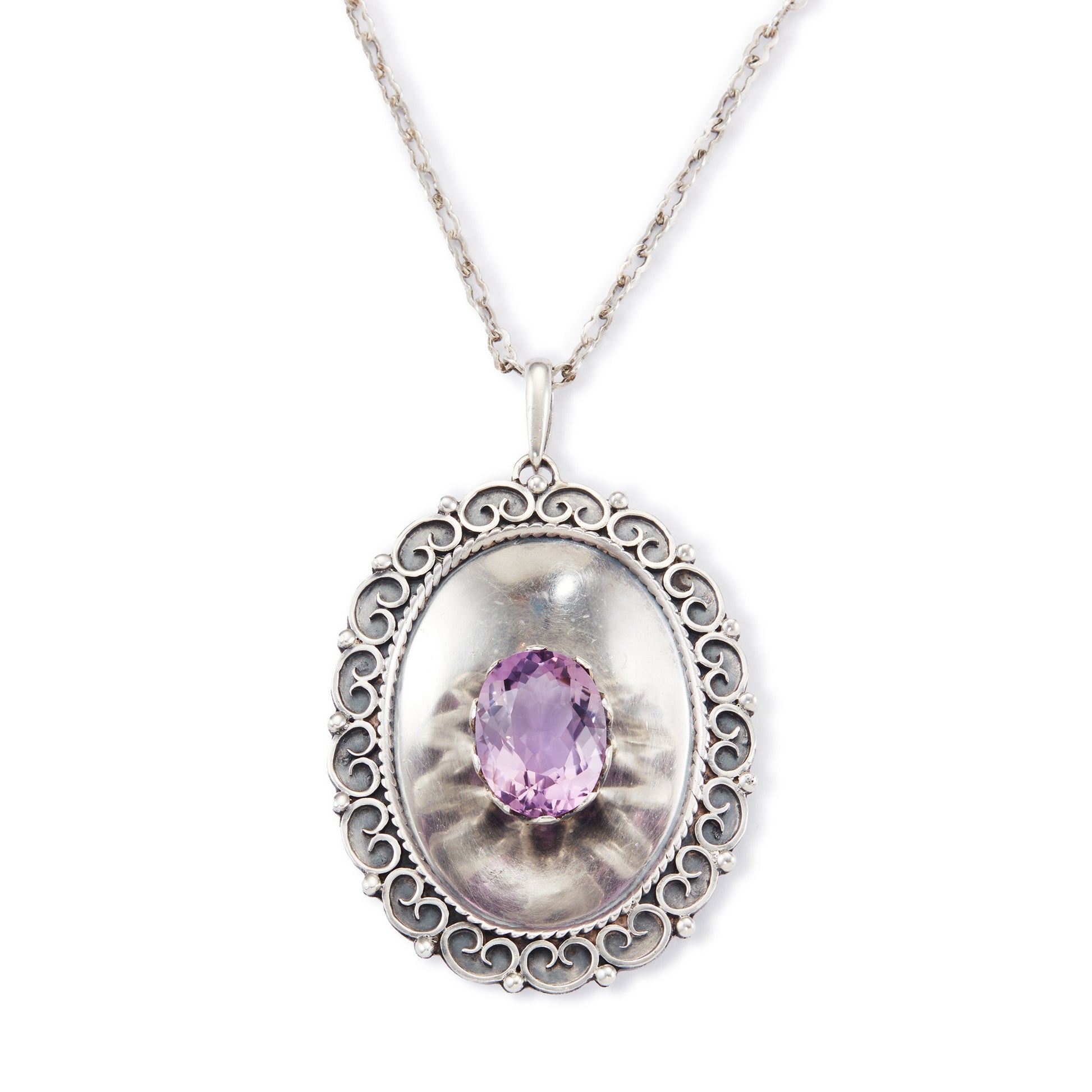 Magnificent Scottish sterling silver pendant centred with a large oval amethyst in a claw setting, with scroll work on the edges. The pendant hangs from an 82.1cm sterling silver fancy link chain.