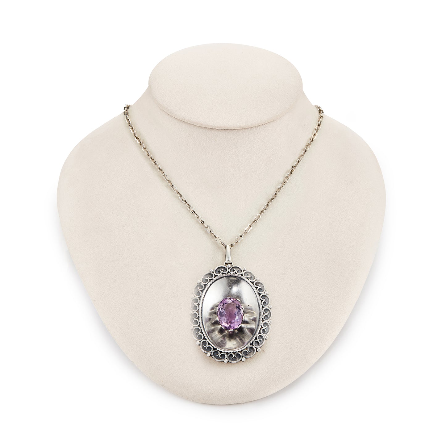 Magnificent Scottish sterling silver pendant centred with a large oval amethyst in a claw setting, with scroll work on the edges. The pendant hangs from an 82.1cm sterling silver fancy link chain.