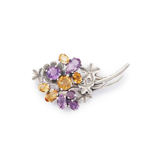 Stunning sterling silver designer brooch set with ten beautifully faceted amethyst and citrine stones. Made by Thomas Millward & Co (Birmingham) Circa 1963