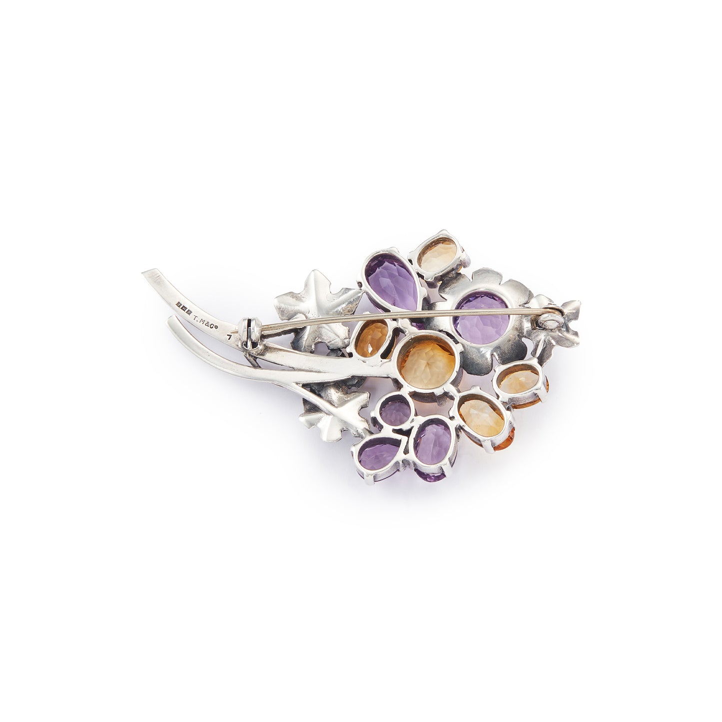 Stunning sterling silver designer brooch set with ten beautifully faceted amethyst and citrine stones. Made by Thomas Millward & Co (Birmingham) Circa 1963