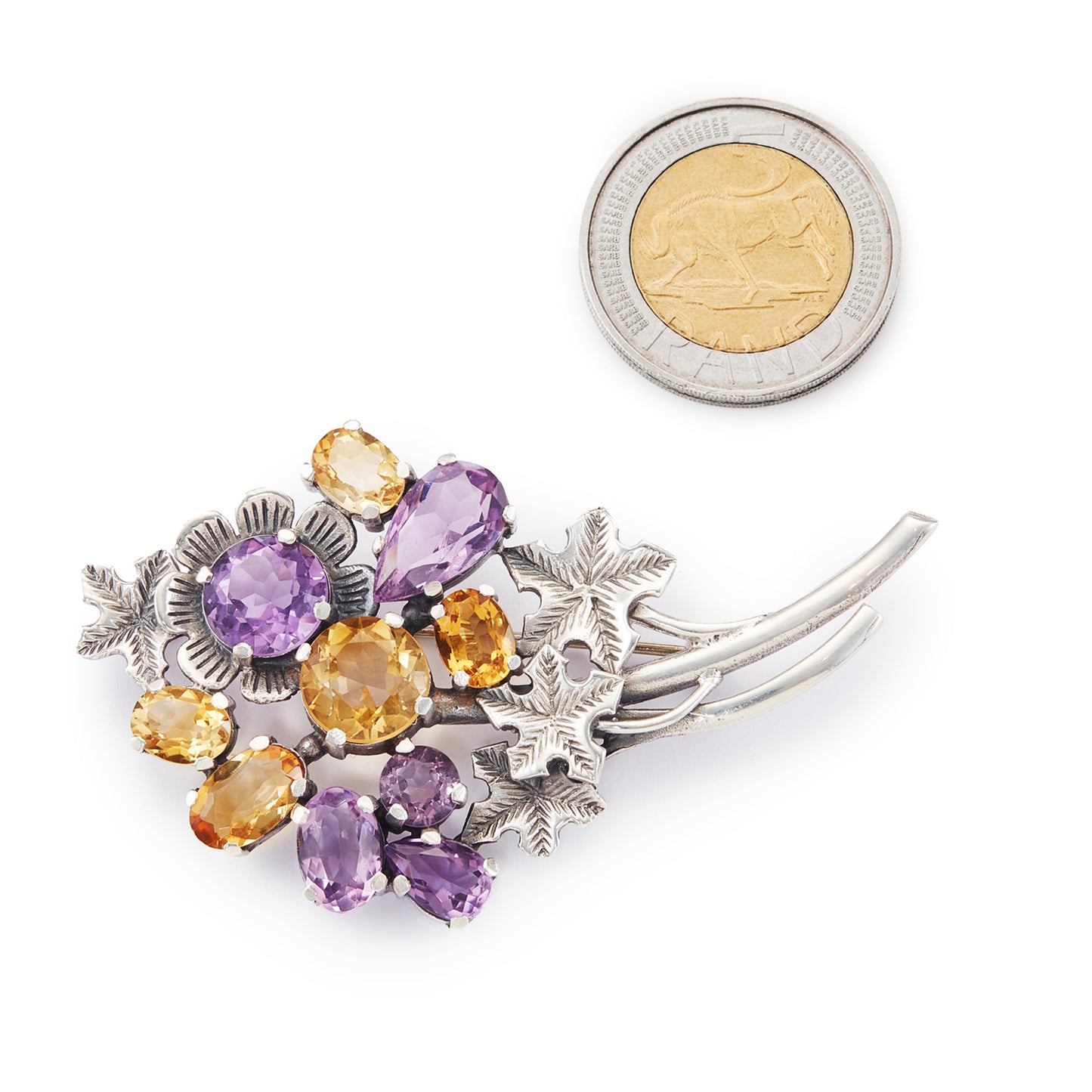 Stunning sterling silver designer brooch set with ten beautifully faceted amethyst and citrine stones. Made by Thomas Millward & Co (Birmingham) Circa 1963