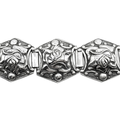 Lovely sterling silver bracelet with a repoussé rose design. Circa 1940’s