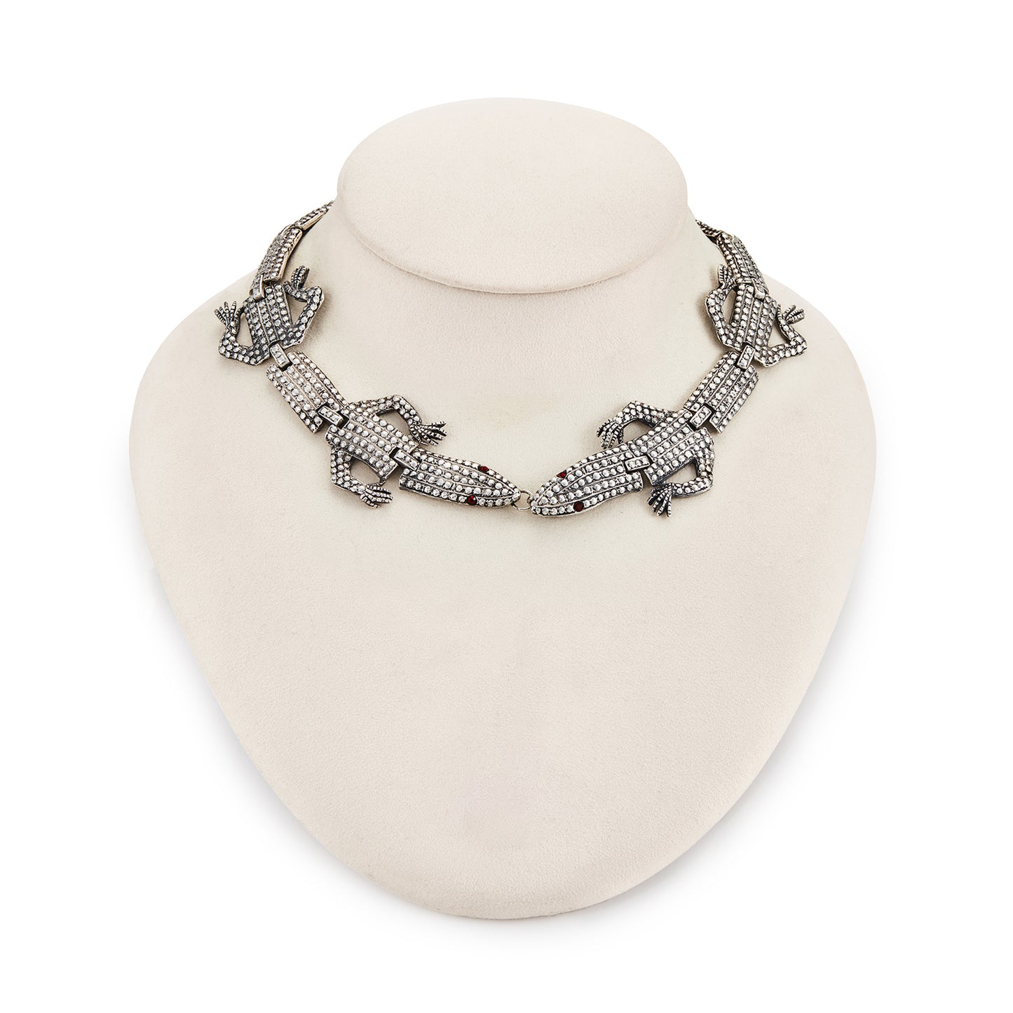 Highly sought after articulated sterling silver Butler and Wilson necklace consisting of two connected lizards with red paste eyes. The necklace can also be divided into a shoulder brooch and a 16cm bracelet, making this a very versatile and fun piece.