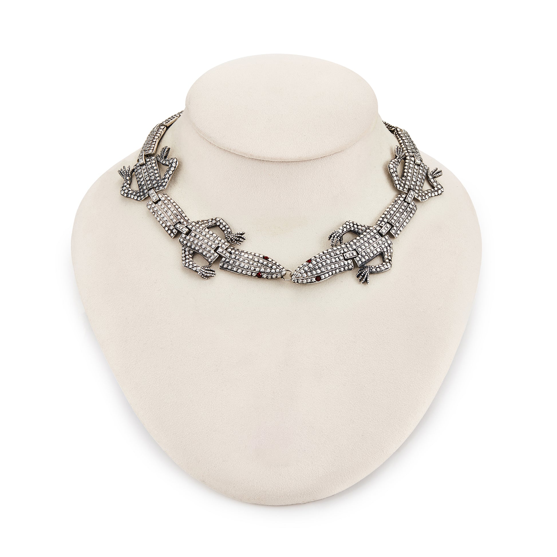 Highly sought after articulated sterling silver Butler and Wilson necklace consisting of two connected lizards with red paste eyes. The necklace can also be divided into a shoulder brooch and a 16cm bracelet, making this a very versatile and fun piece.