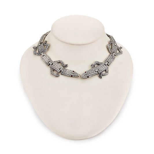 Highly sought after articulated sterling silver Butler and Wilson necklace consisting of two connected lizards with red paste eyes. The necklace can also be divided into a shoulder brooch and a 16cm bracelet, making this a very versatile and fun piece.
