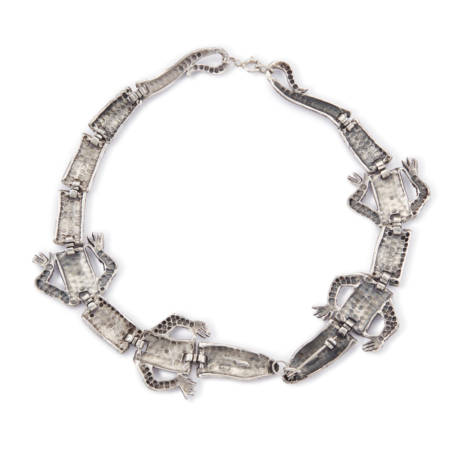 Highly sought after articulated sterling silver Butler and Wilson necklace consisting of two connected lizards with red paste eyes. The necklace can also be divided into a shoulder brooch and a 16cm bracelet, making this a very versatile and fun piece.