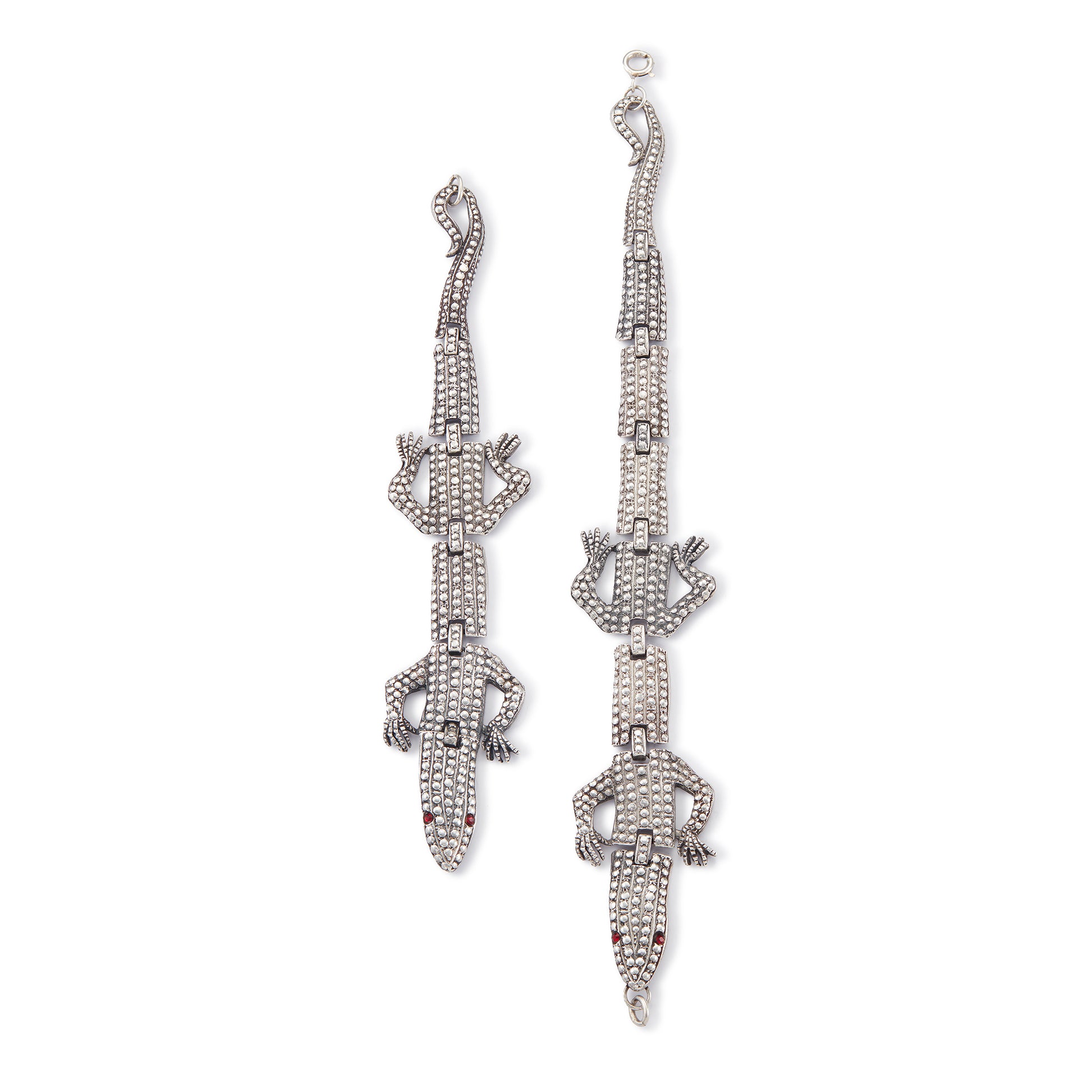 Highly sought after articulated sterling silver Butler and Wilson necklace consisting of two connected lizards with red paste eyes. The necklace can also be divided into a shoulder brooch and a 16cm bracelet, making this a very versatile and fun piece.