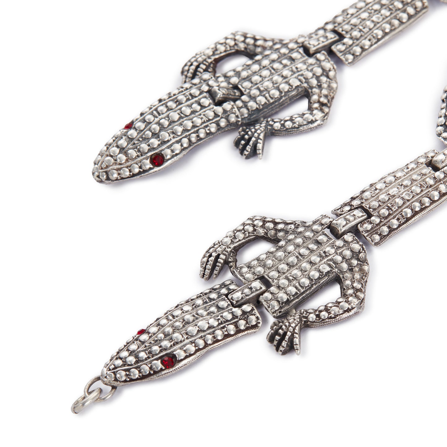 Highly sought after articulated sterling silver Butler and Wilson necklace consisting of two connected lizards with red paste eyes. The necklace can also be divided into a shoulder brooch and a 16cm bracelet, making this a very versatile and fun piece.