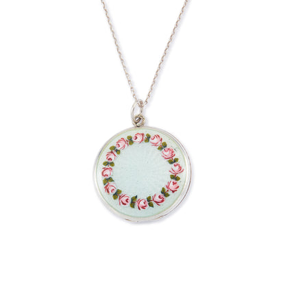 Pretty vintage sterling silver locket with an enamel floral design on a light blue background, on a sterling silver chain.