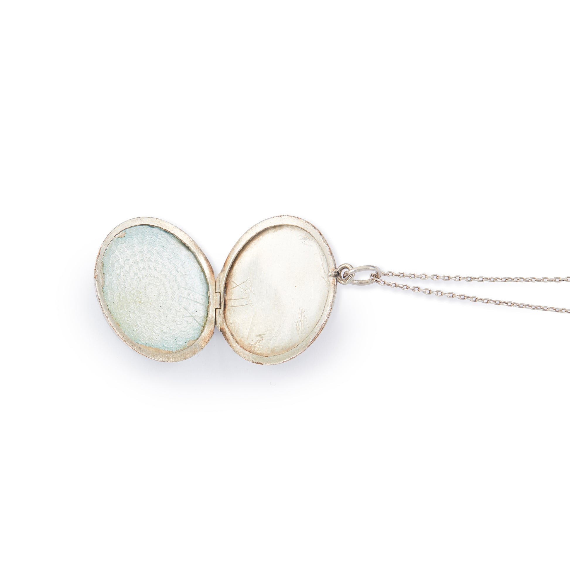 Pretty vintage sterling silver locket with an enamel floral design on a light blue background, on a sterling silver chain.