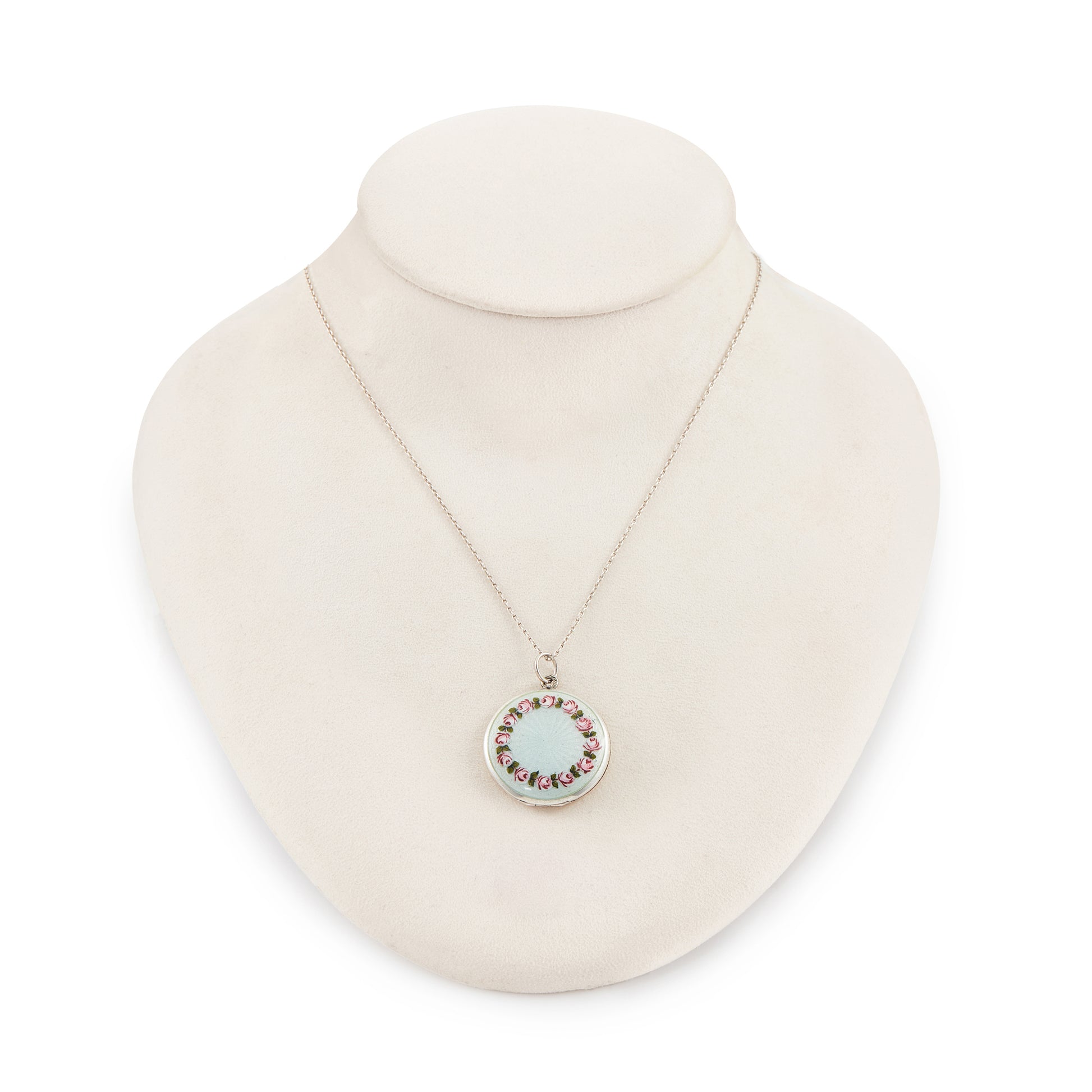Pretty vintage sterling silver locket with an enamel floral design on a light blue background, on a sterling silver chain.