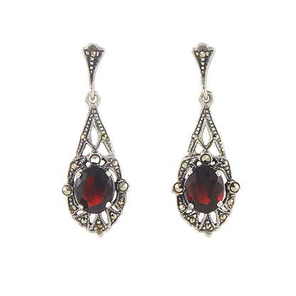 Stunning sterling silver drop earrings, each set with a beautifully faceted garnet and marcasite stones.