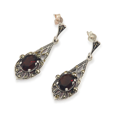 Stunning sterling silver drop earrings, each set with a beautifully faceted garnet and marcasite stones.
