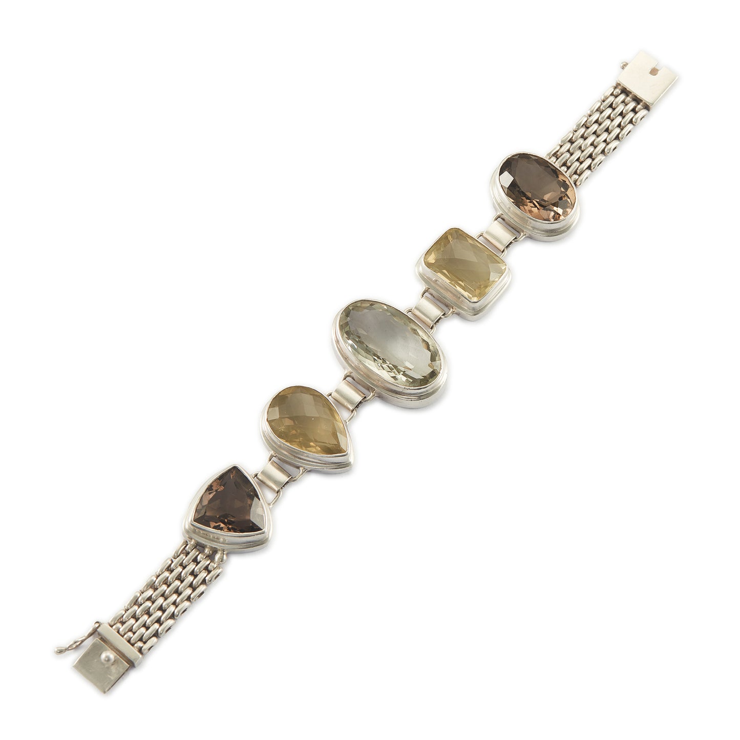 Stunning chunky sterling silver bracelet set with large, beautifully faceted citrine, smoky quartz and a green amethyst in the centre. The bracelet has a safety clasp.