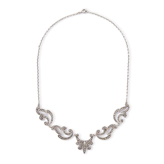 Lovely sterling silver scalloped necklace with claw-set marcasites. Made in France.
Circa 1930s