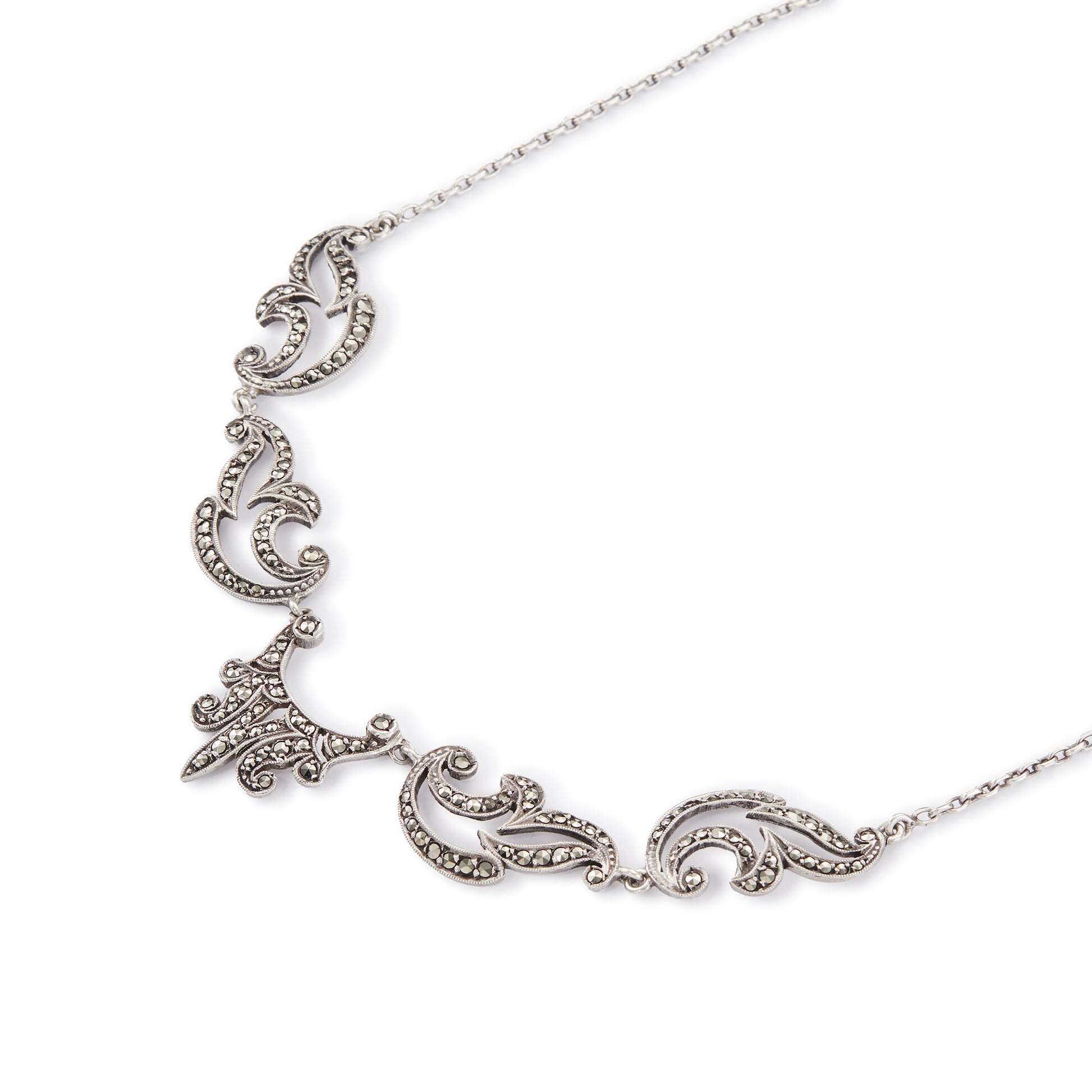 Lovely sterling silver scalloped necklace with claw-set marcasites. Made in France.
Circa 1930s