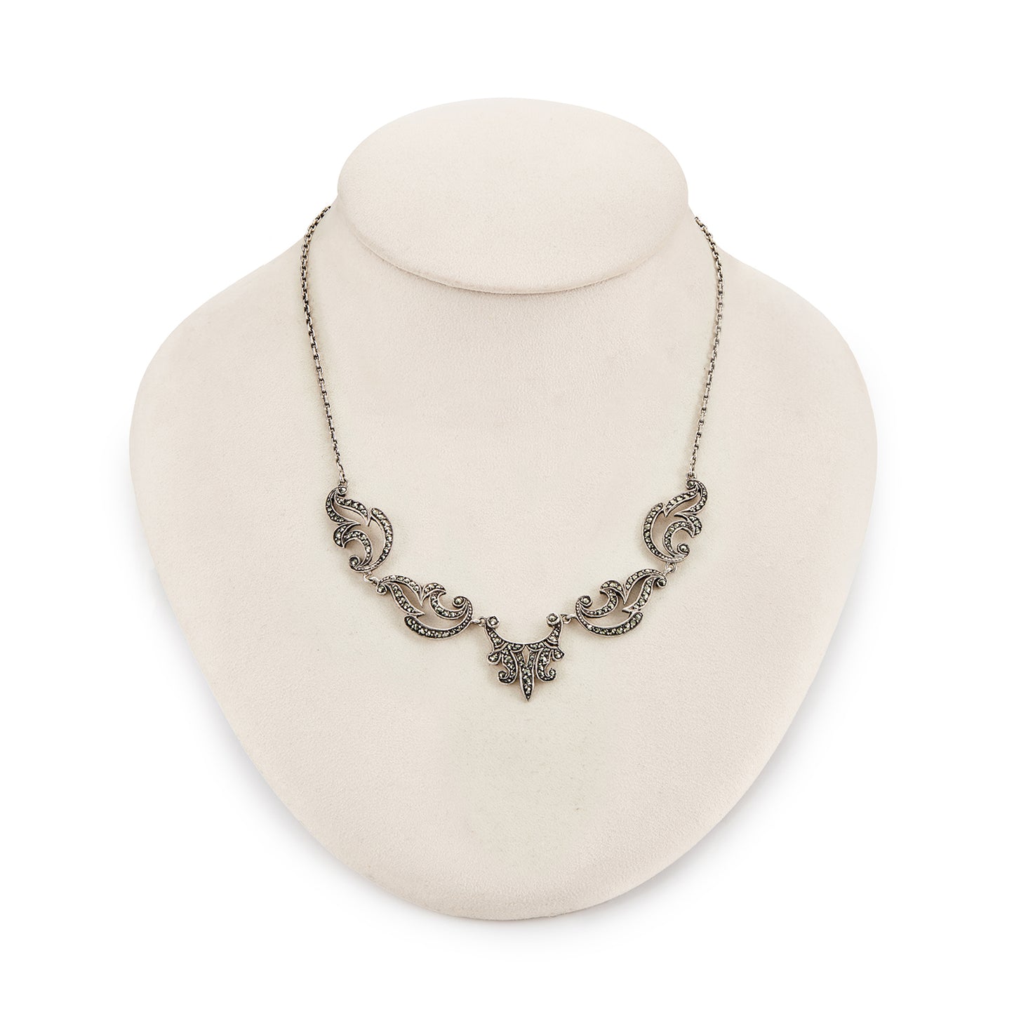 Lovely sterling silver scalloped necklace with claw-set marcasites. Made in France.
Circa 1930s