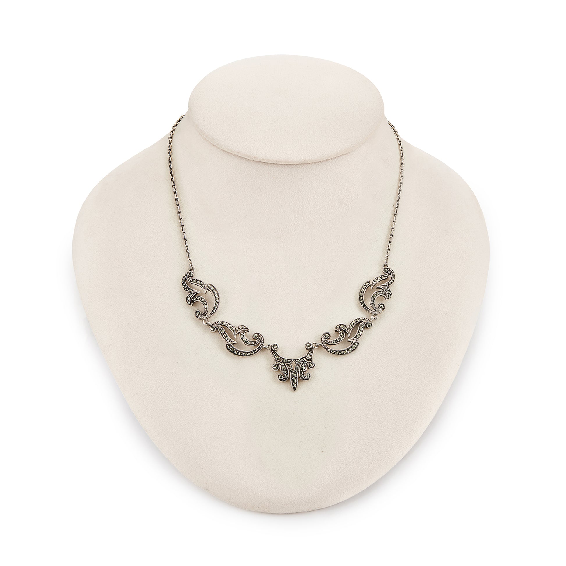 Lovely sterling silver scalloped necklace with claw-set marcasites. Made in France.
Circa 1930s