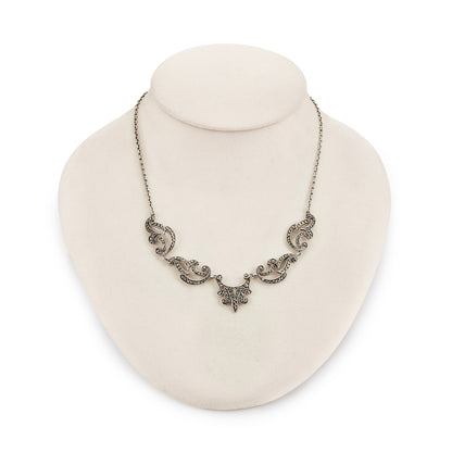 Lovely sterling silver scalloped necklace with claw-set marcasites. Made in France.
Circa 1930s