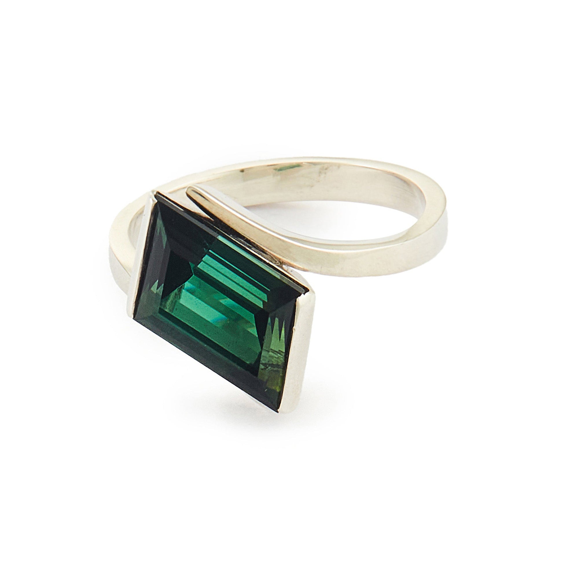 Striking Modernist sterling silver ring set with a beautiful, deep-green tourmaline gemstone.