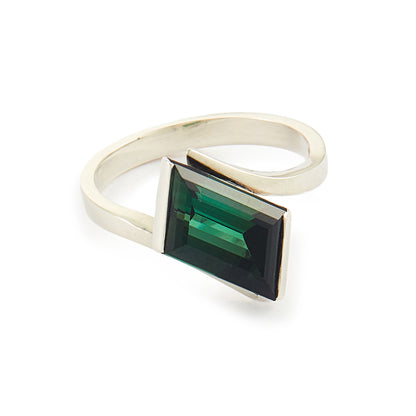 Striking Modernist sterling silver ring set with a beautiful, deep-green tourmaline gemstone.