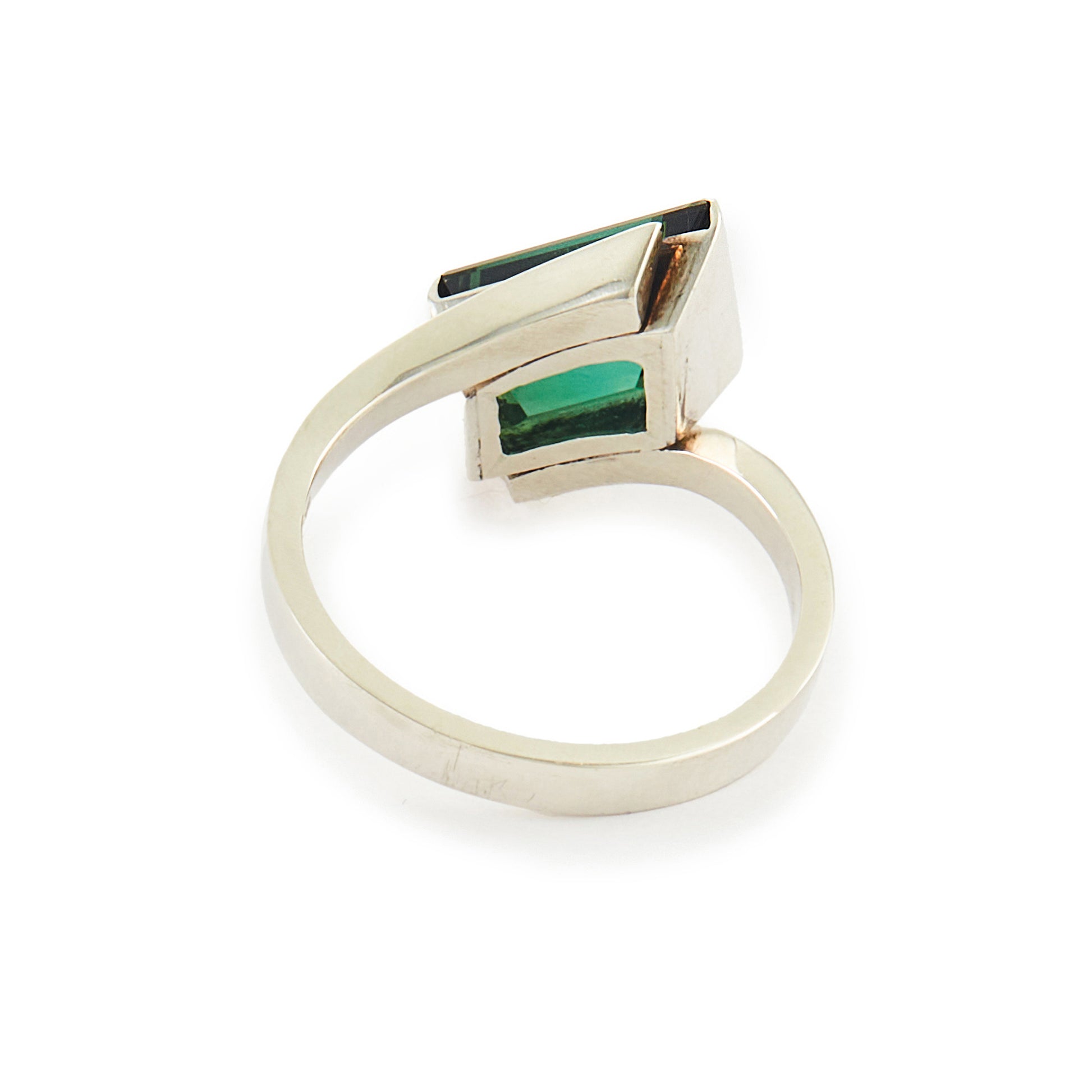 Striking Modernist sterling silver ring set with a beautiful, deep-green tourmaline gemstone.