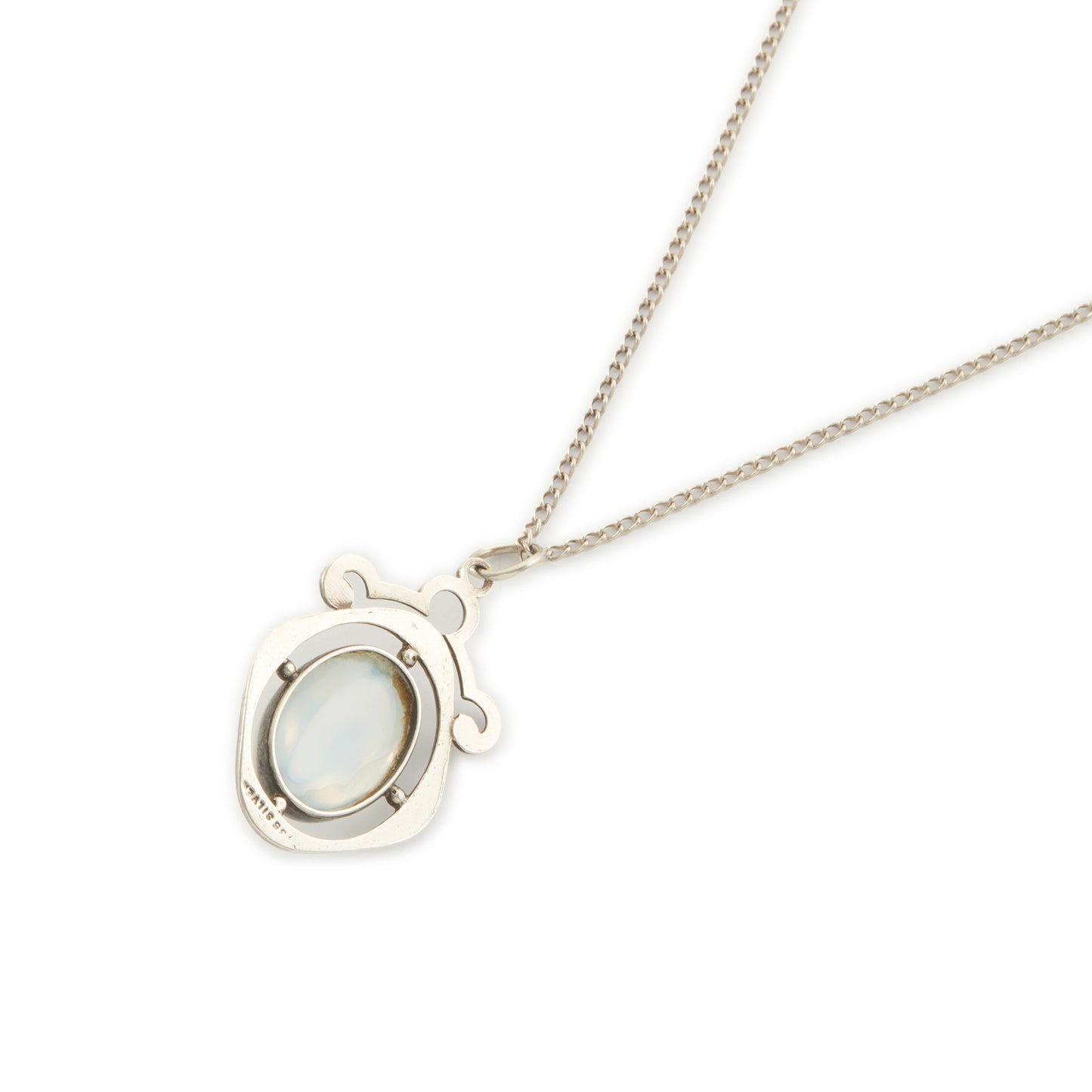 Classic 1930s sterling silver pendant set with a beautiful cabochon oval moonstone on a later silver chain.
