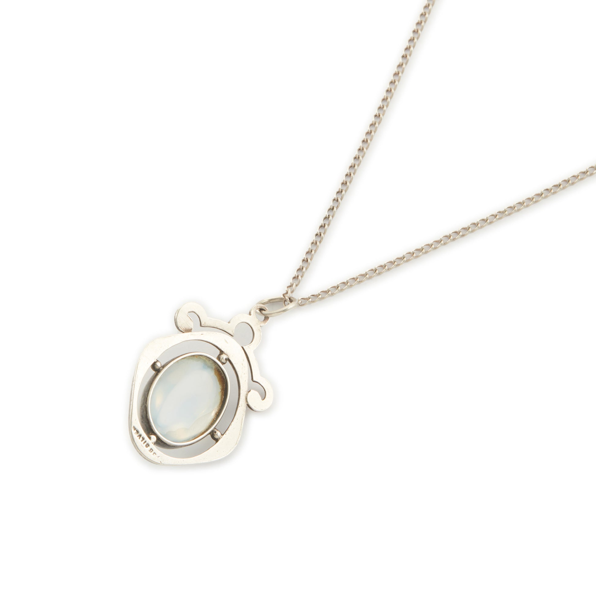 Classic 1930s sterling silver pendant set with a beautiful cabochon oval moonstone on a later silver chain.