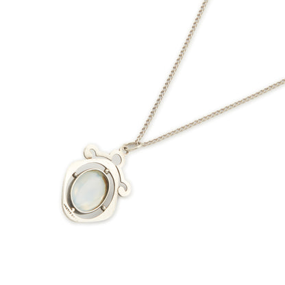 Classic 1930s sterling silver pendant set with a beautiful cabochon oval moonstone on a later silver chain.