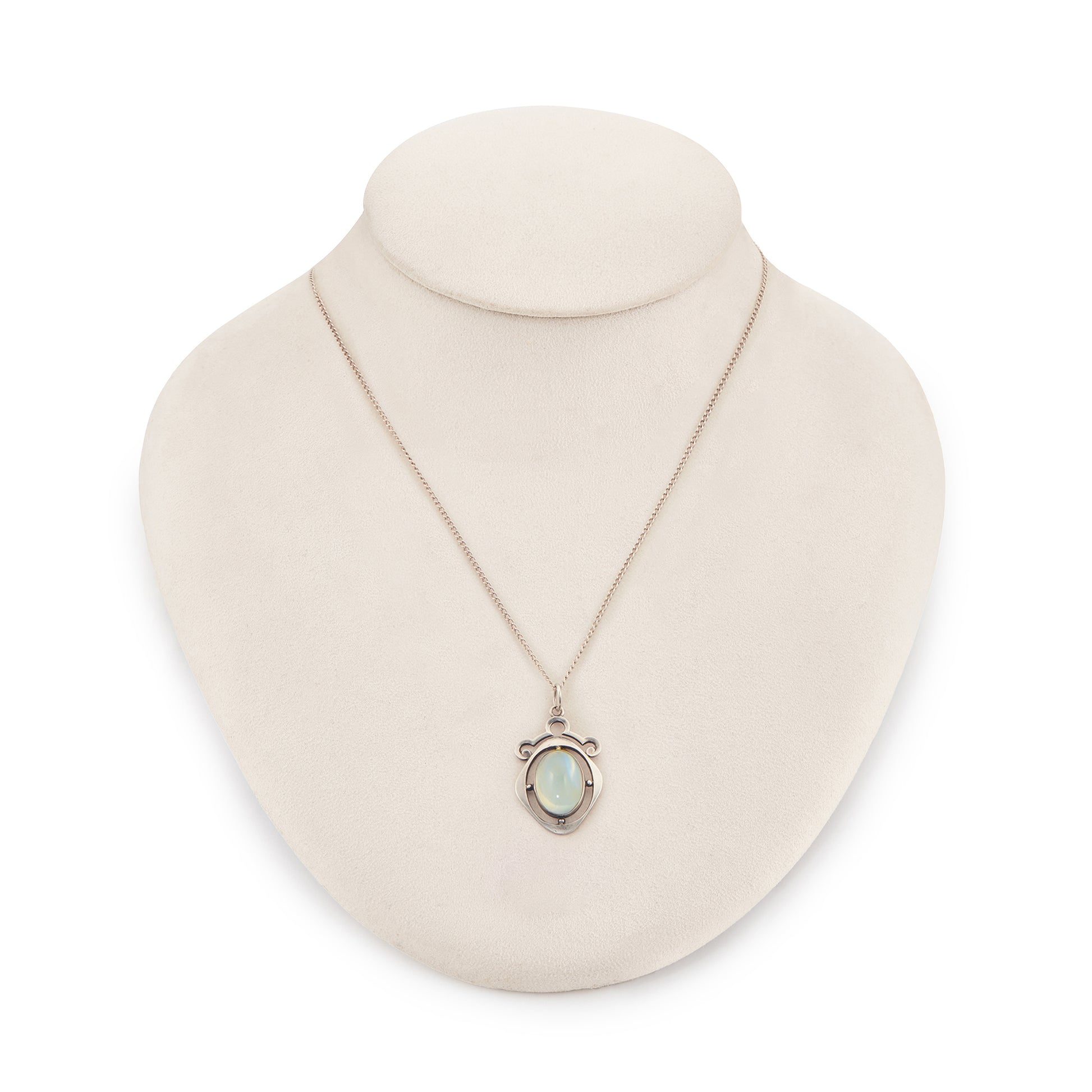 Classic 1930s sterling silver pendant set with a beautiful cabochon oval moonstone on a later silver chain.