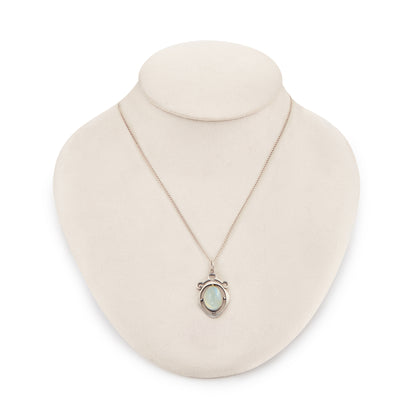 Classic 1930s sterling silver pendant set with a beautiful cabochon oval moonstone on a later silver chain.