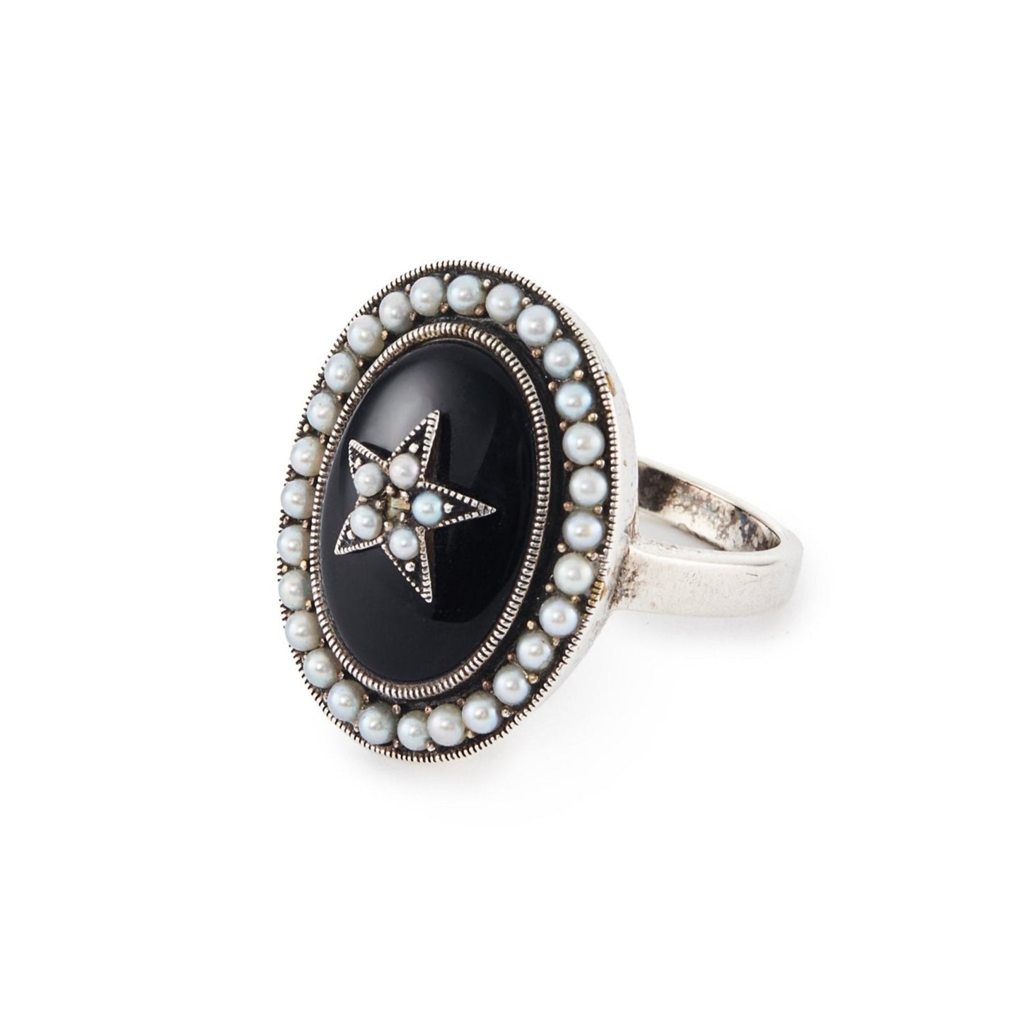 Lovely vintage sterling silver ring with an oval onyx stone, set with a star in the centre and a seed pearl surround.