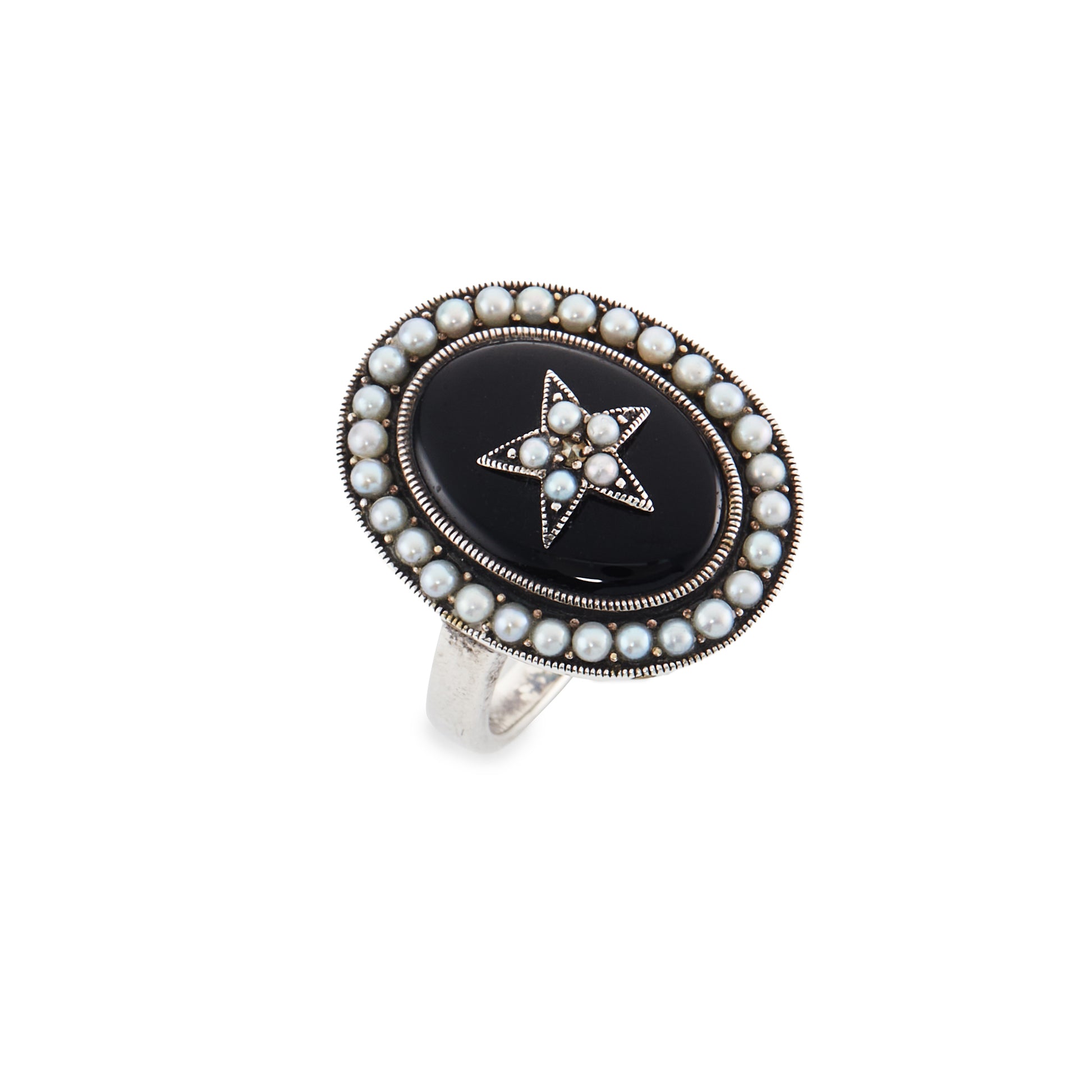 Lovely vintage sterling silver ring with an oval onyx stone, set with a star in the centre and a seed pearl surround.