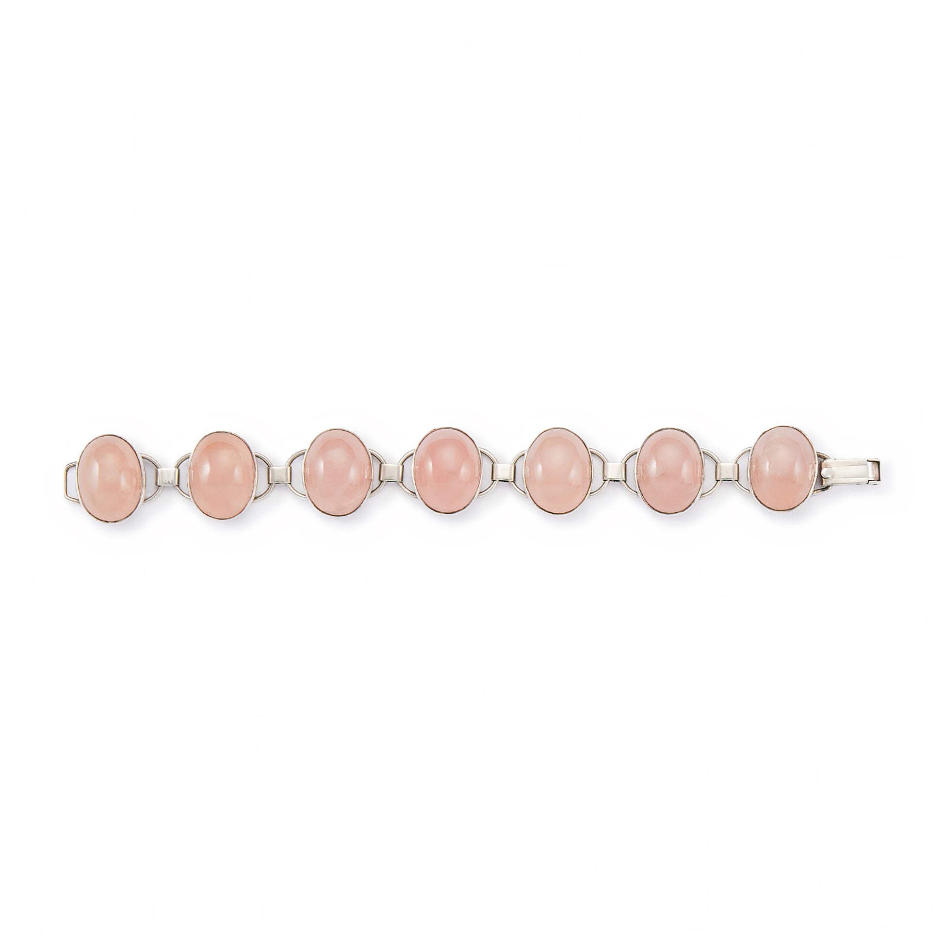 Lovely sterling silver articulated mid-century bracelet set with seven rose quartz cabochon stones. There is oxidation on the back of the bracelet.