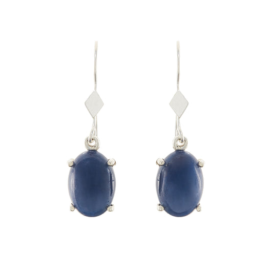 Sterling silver drop earrings, each set with a deep-blue cabochon star sapphire.