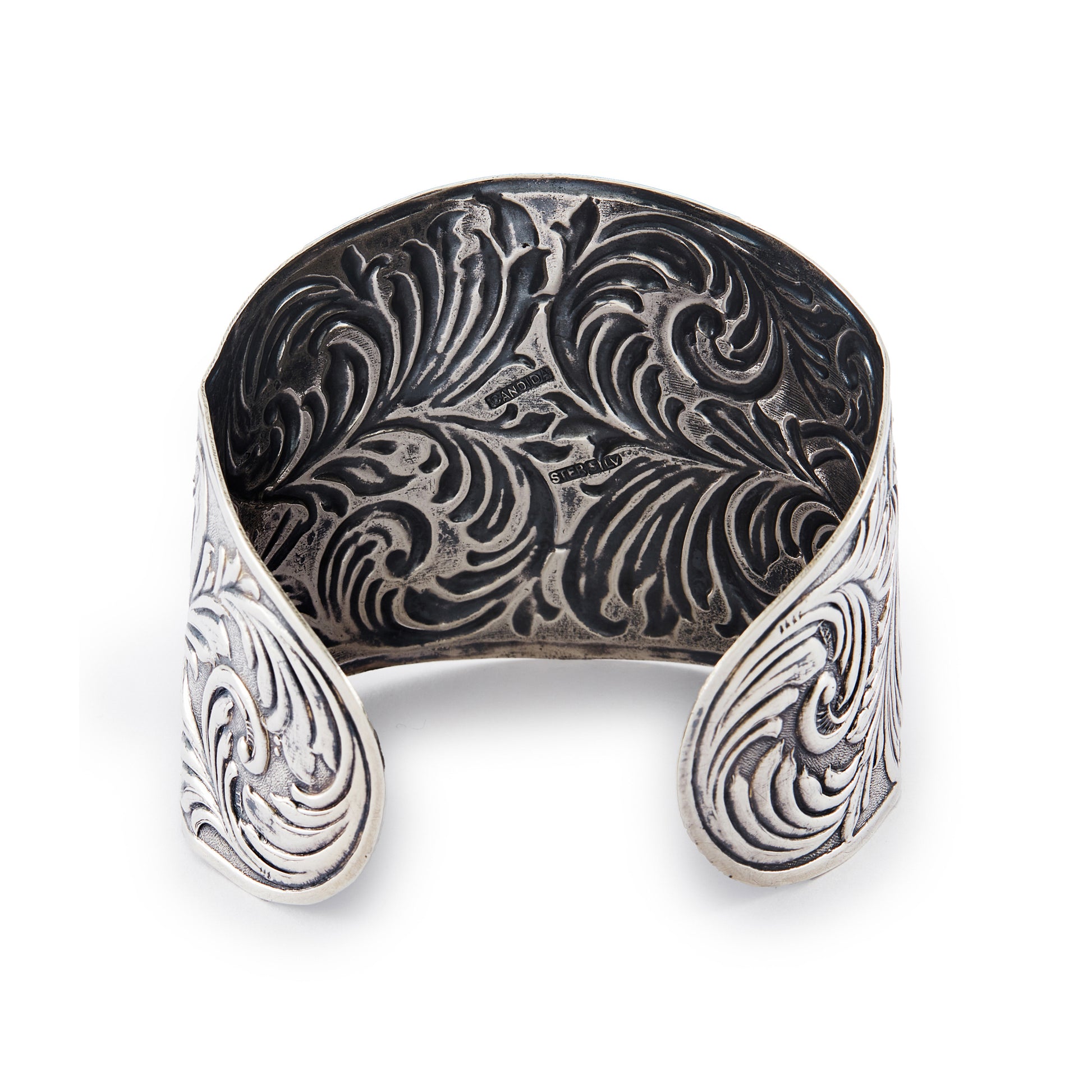 Beautifully embossed, large open sterling silver Candida bangle. Size adjustable
Hallmarked: Candida Sterling Silver