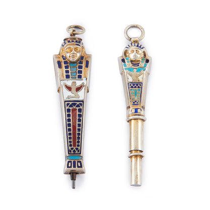 Set of two highly collectible, beautifully enamelled Egyptian Pharaoh pendants, one is a working pencil with the lead intact.