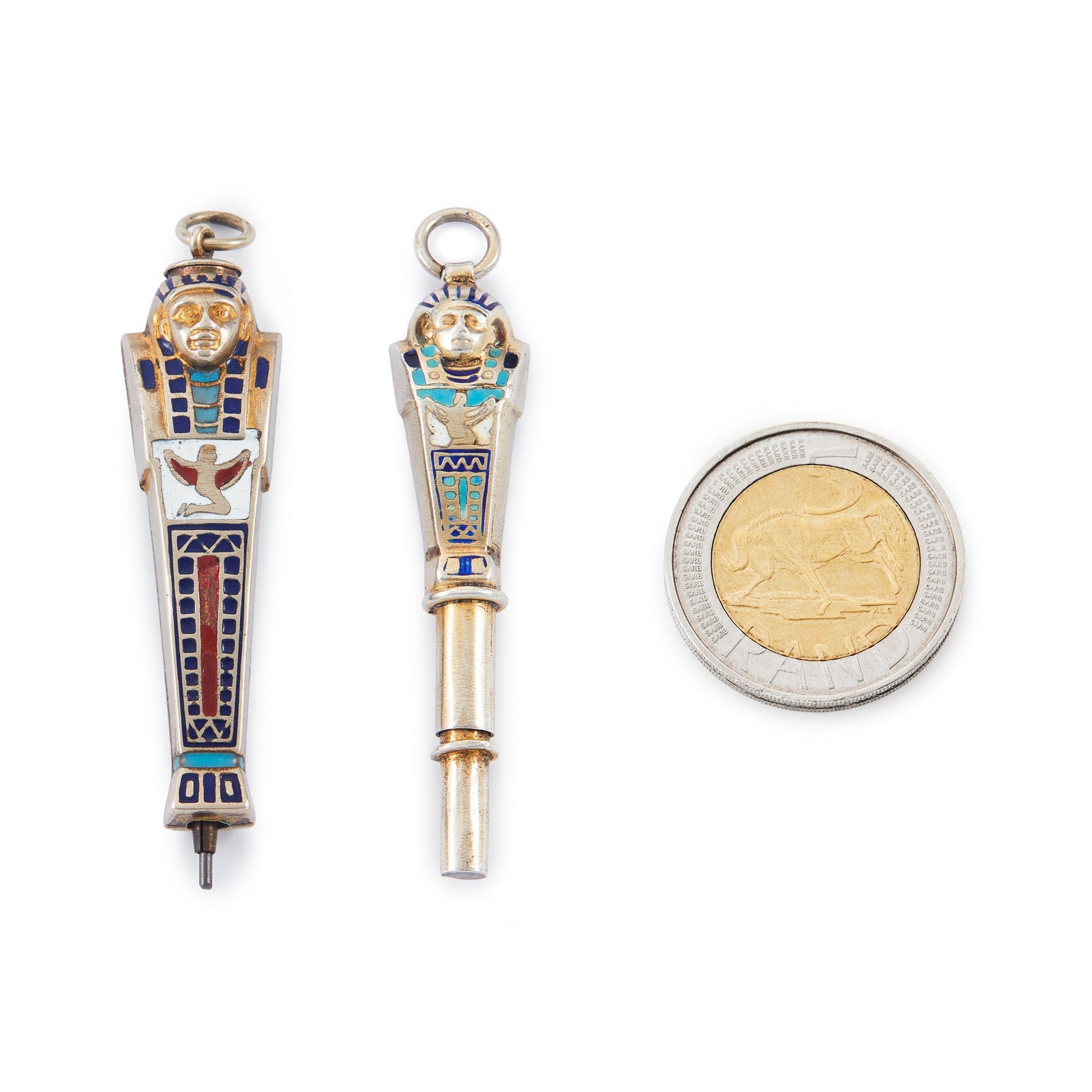 Set of two highly collectible, beautifully enamelled Egyptian Pharaoh pendants, one is a working pencil with the lead intact.