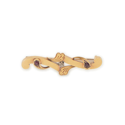 Dainty Victorian 15ct gold bar brooch set with two faceted rubies and a natural diamond in the centre.