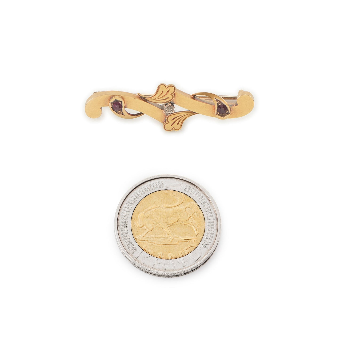 Dainty Victorian 15ct gold bar brooch set with two faceted rubies and a natural diamond in the centre.