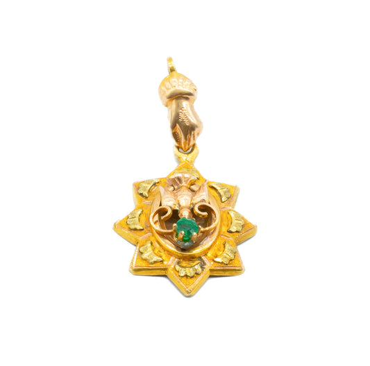 Exquisite Victorian 15ct rose and yellow gold pendant depicting a hand and dove, set with a faceted emerald.