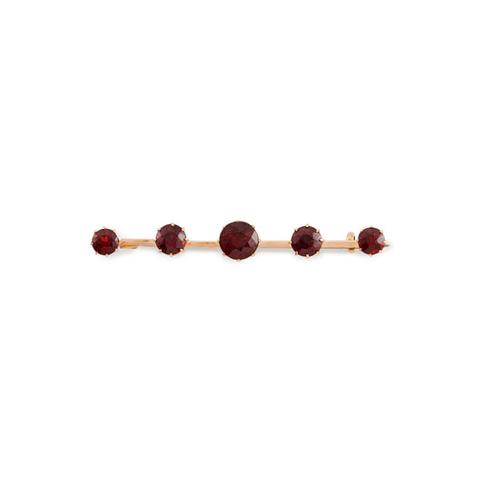 Classic 15ct rose gold Victorian bar brooch set with five beautifully faceted deep red garnets.