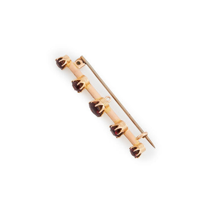Classic 15ct rose gold Victorian bar brooch set with five beautifully faceted deep red garnets.