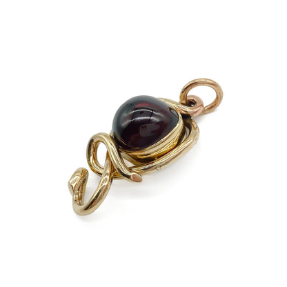 Stunning Victorian 15ct gold mourning pendant set with a deep red cabochon garnet.