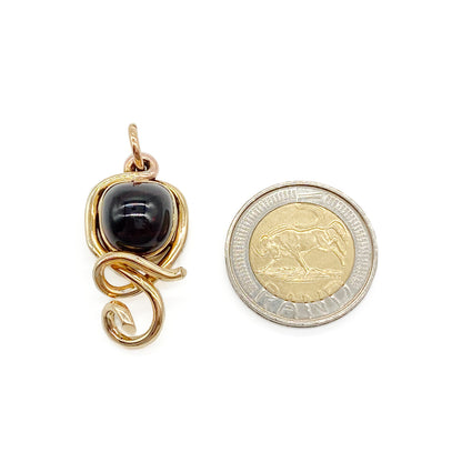 Stunning Victorian 15ct gold mourning pendant set with a deep red cabochon garnet.