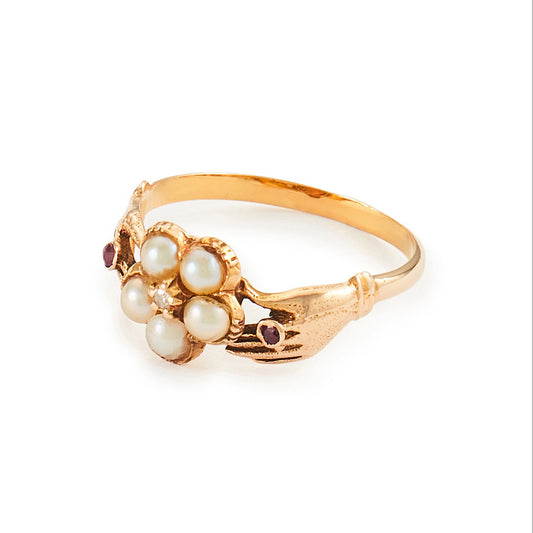 Delightful Victorian 15ct Gold claddagh ring, with two hands holding a seed pearl flower, centred by a small diamond and a tiny ruby on each side.