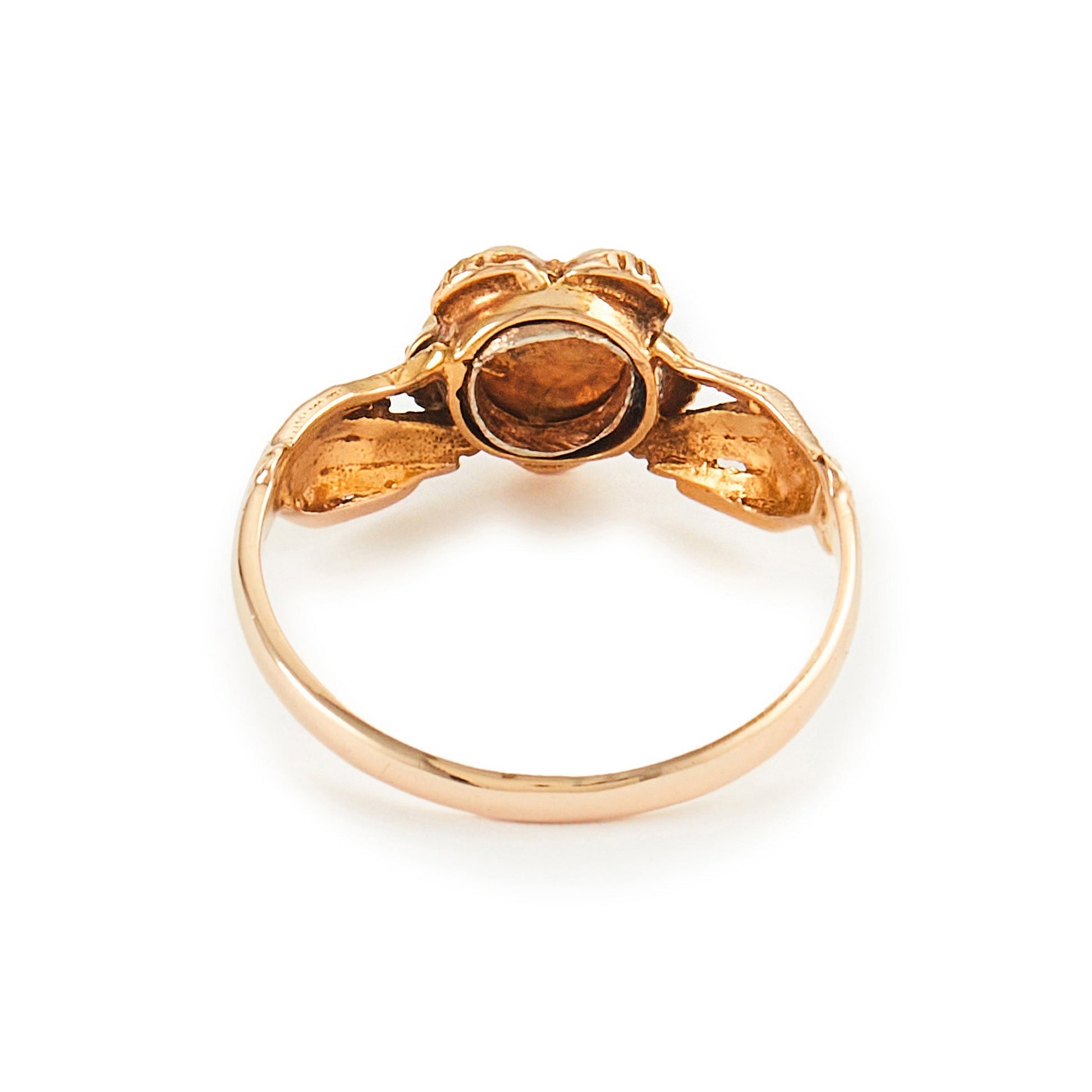 Delightful Victorian 15ct Gold claddagh ring, with two hands holding a seed pearl flower, centred by a small diamond and a tiny ruby on each side.
