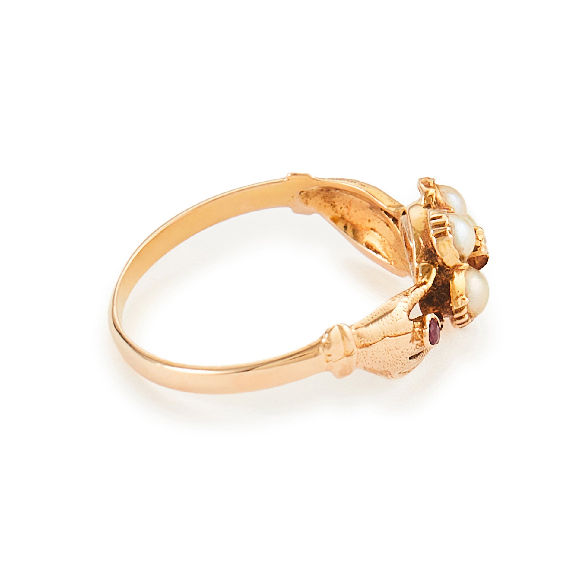 Delightful Victorian 15ct Gold claddagh ring, with two hands holding a seed pearl flower, centred by a small diamond and a tiny ruby on each side.