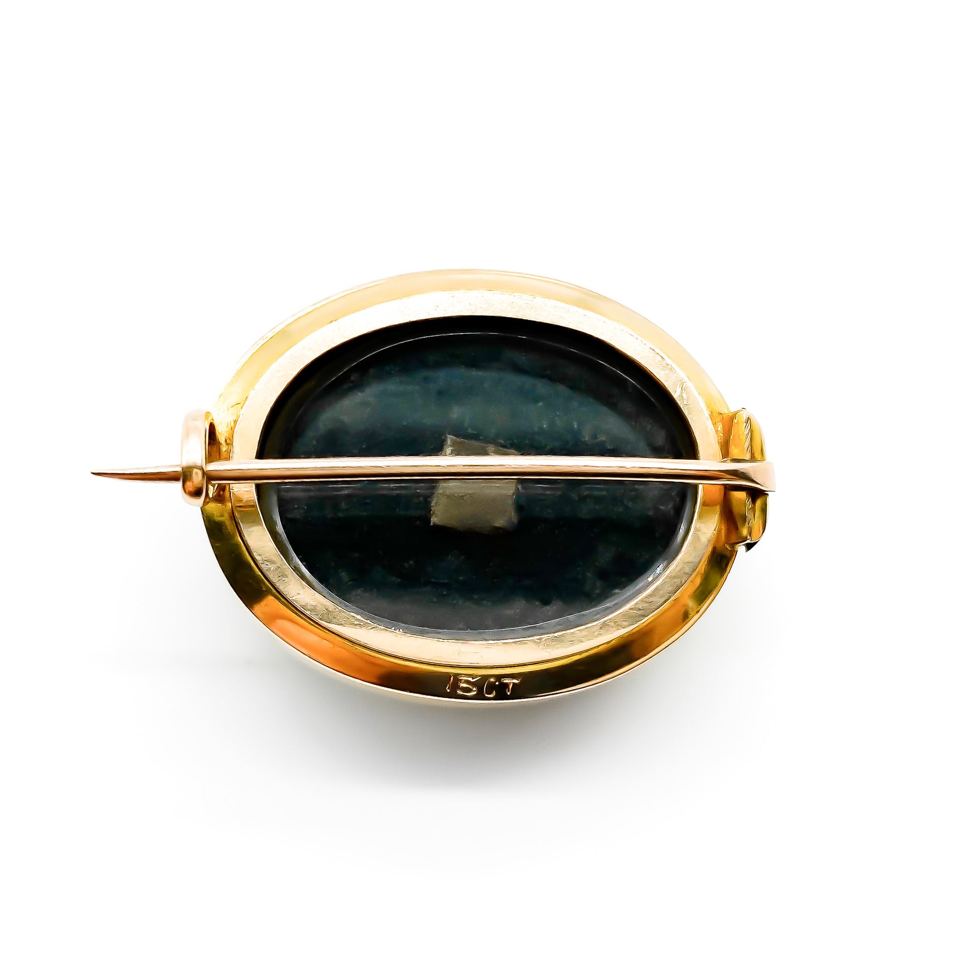 Charming 15ct rose gold mourning brooch set with an oval onyx cabochon with a seed pearl motif in centre. Brooch has a bevelled glass backing.