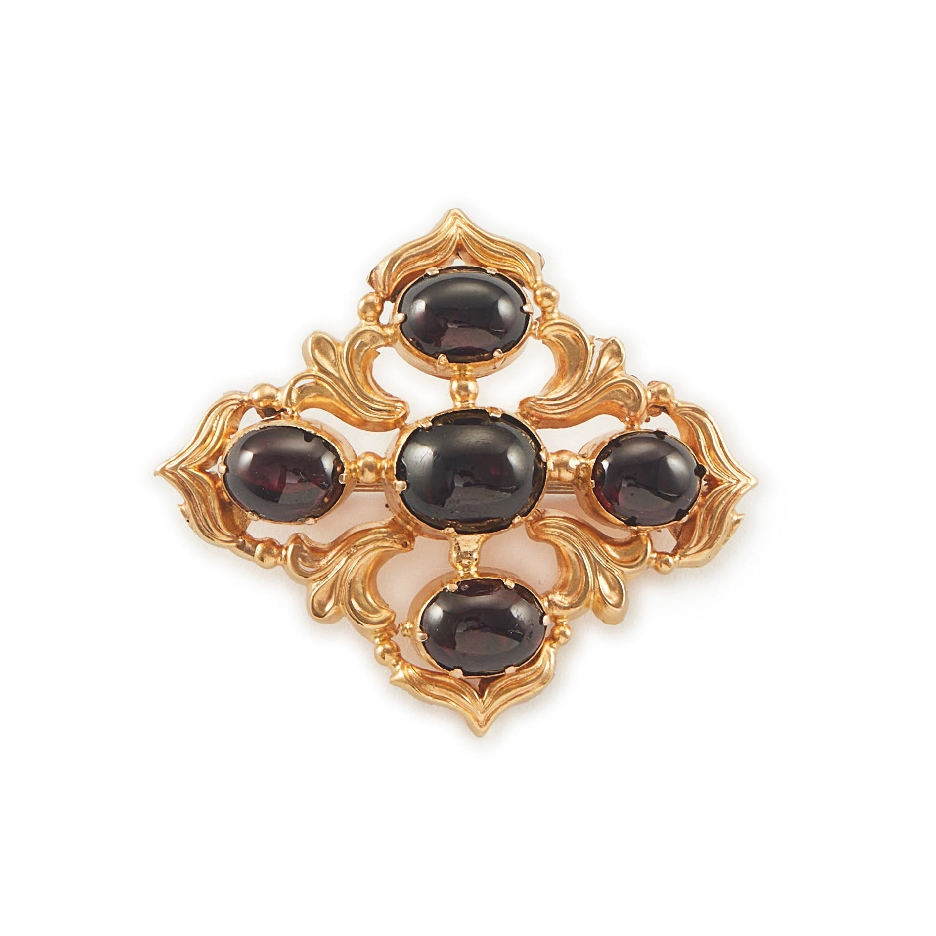 Beautiful Victorian repoussé brooch set with four cabochon Bohemian garnets. The piece can also be worn as a pendant.